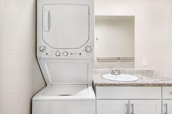 A washer and dryer in a bathroom